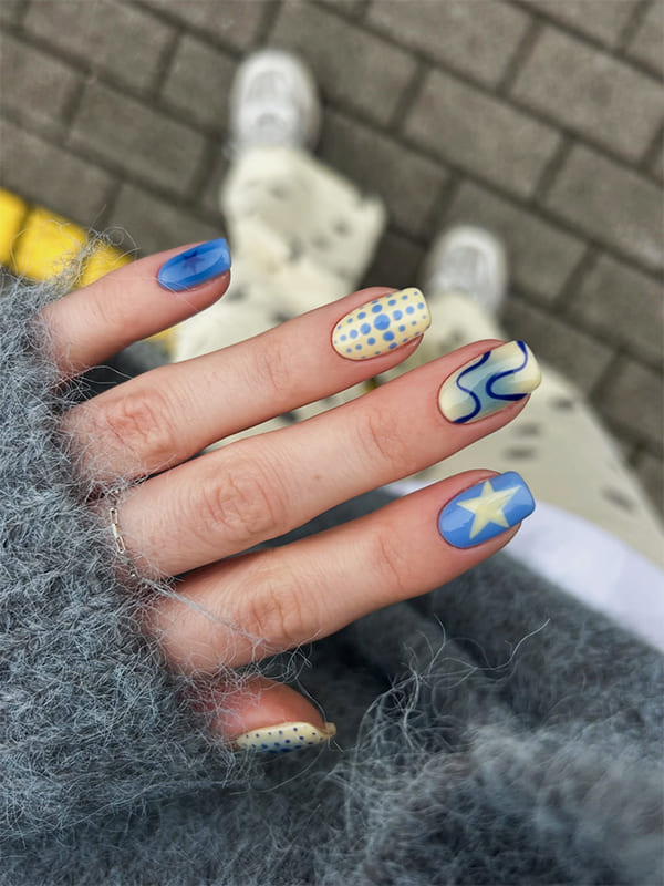 Light Blue Nails with Star and Dot Accents